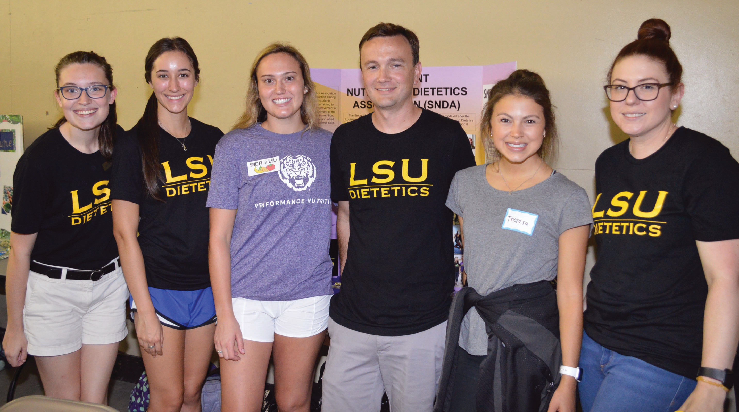 six dietetics students in dietetics shirts