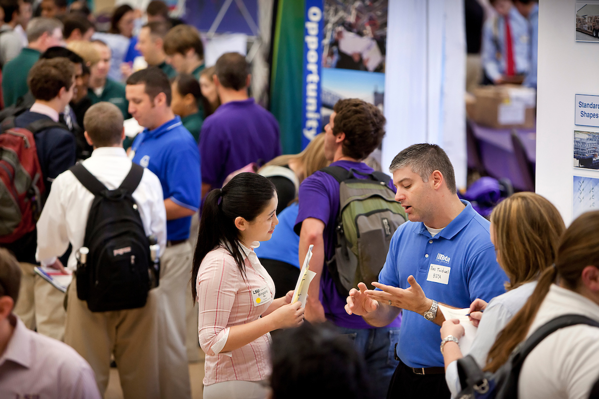 Students and employers mingle at a career day event at LSU