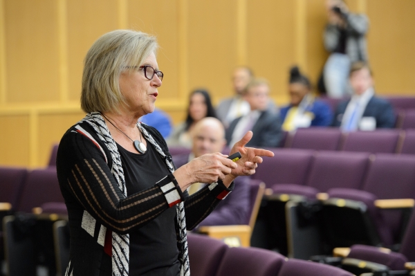 Woman speaks in front of audience