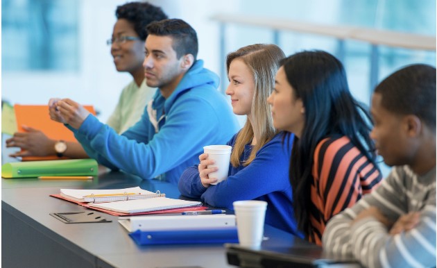 Five people sitting at a desk