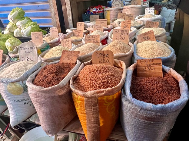 different types of rice in sacks at a bazaar