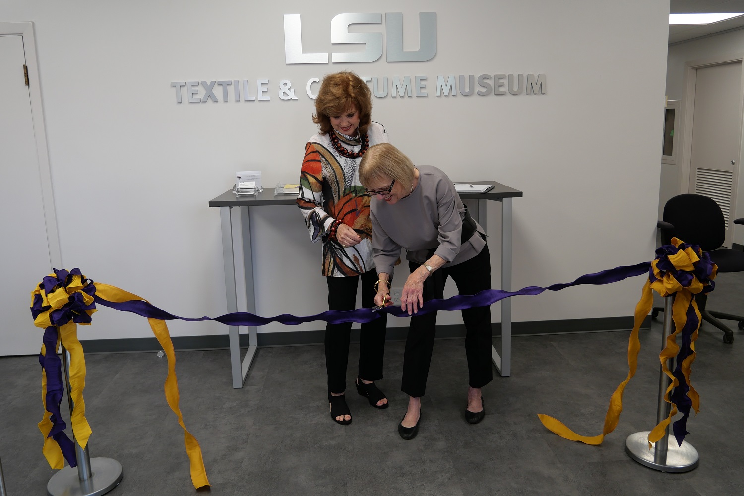 Pam cutting the ribbon.